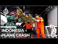 Family, friends of Indonesia plane crash passengers await news
