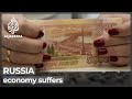 Russia sees sanctions hit with currency value drop