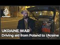 Volunteers shuttle between Poland and Ukraine to provide aid