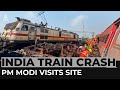 India rail disaster: PM Modi visits worst crash in decades