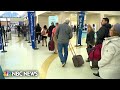 Thousands stuck at airports amid flight delays and cancellations