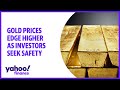 Gold prices edge higher as investors seek safety, oil pulls back