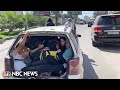 WATCH: Residents of Gaza City pack into vehicles and head south after Israel's warning