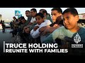 Truce holding: Thousands rush to reunite with families
