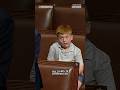 Congressman’s son caught makes funny faces during his dad’s speech