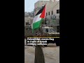 Palestinian waves flag in front of Israeli military vehicles | AJ #shorts