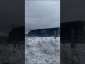 Train collides with truck stuck on track due to ice and snow